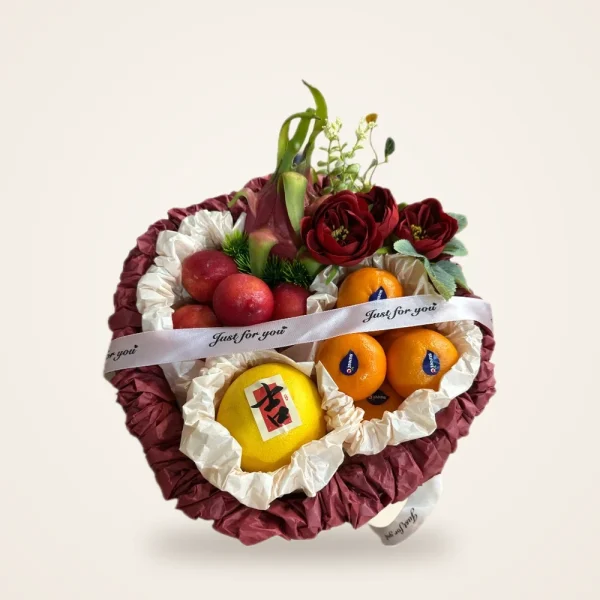 Dragon Fruit & Rose Maroon Fruit Basket - dragon fruit, apples, oranges and roses in a maroon ruffle basket with 'Just for you' ribbon