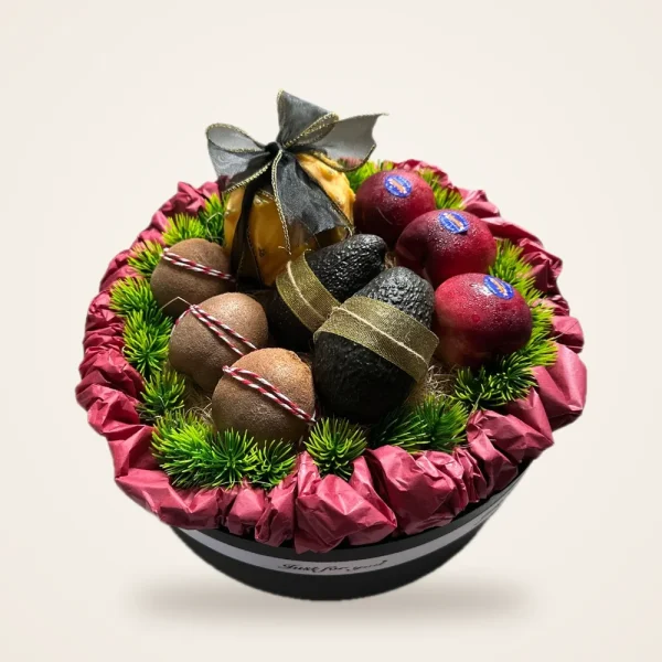 Maroon Hatbox Kiwi & Avocado Fruit Basket - kiwi, avocado and apples in a round black hatbox with maroon ruffle