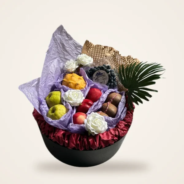 Purple Tissue Hatbox Fruit Basket - dragon fruit, blueberries, apples and white roses in purple tissue on a round hatbox