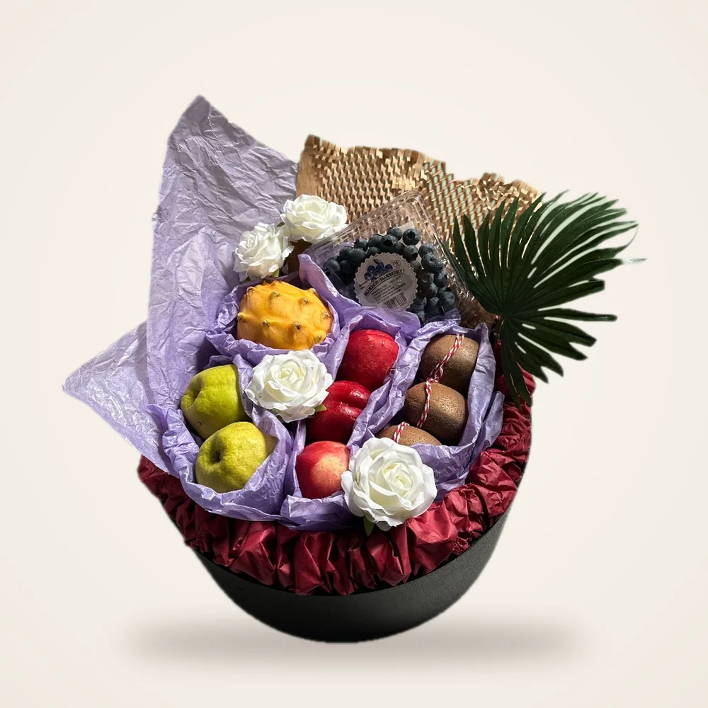 Purple Tissue Hatbox Fruit Basket - dragon fruit, blueberries, apples and white roses in purple tissue on a round hatbox (view 2)